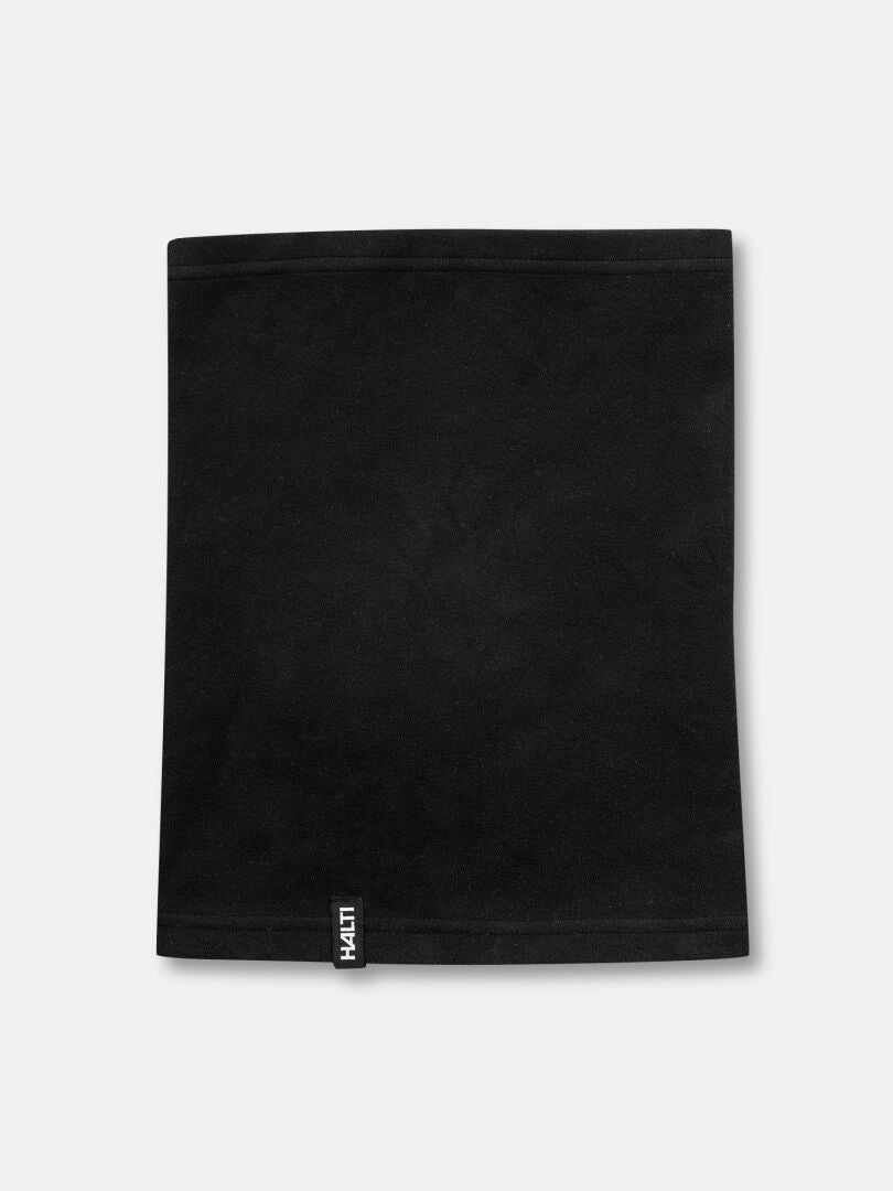 The Halti Trone Tube Scarf Fleece, black and lightweight, lies flat with a black and white tag at the bottom edge.