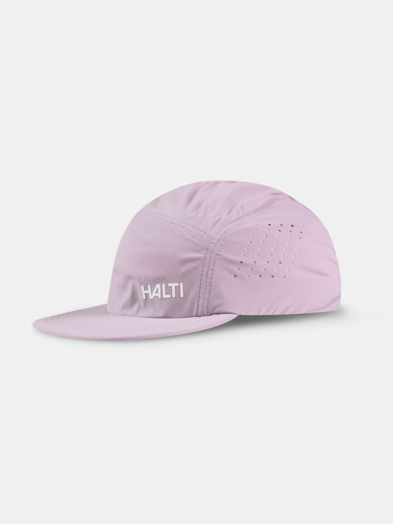 The Halti Luovi Cap is a light purple, breathable, flat-brim training cap with the logo on front, shown on white.