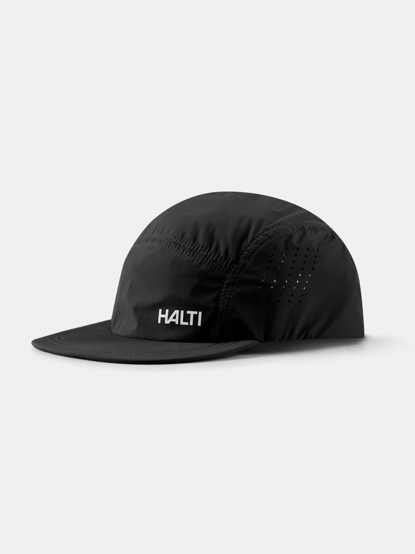 The Halti Luovi Cap in black features a curved brim and ventilation holes, displayed on a plain white background.