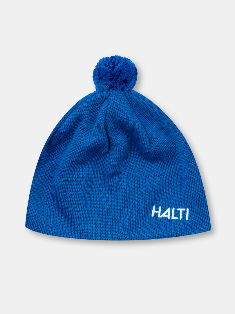 The Halti Peesi II Beanie is a blue wool-blend winter hat with a pom-pom and 