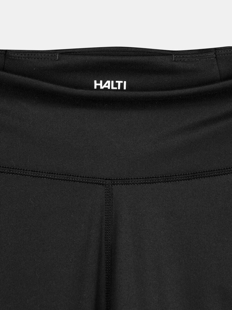 Close-up of the waistband and upper section of Halti Kaldu Training Tights Women's with a small Halti logo.
