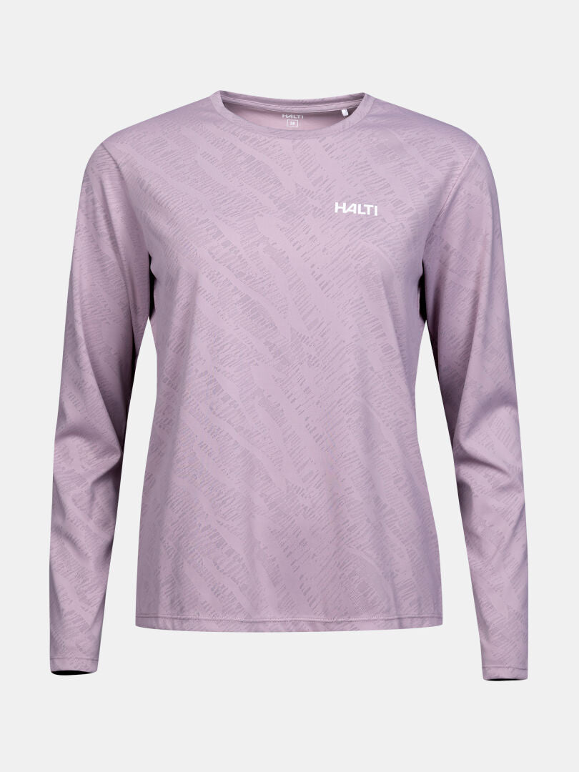 The Halti Oulanka Training Shirt Women's is light purple, long sleeve, moisture-wicking, UPF 50+, with a subtle pattern.