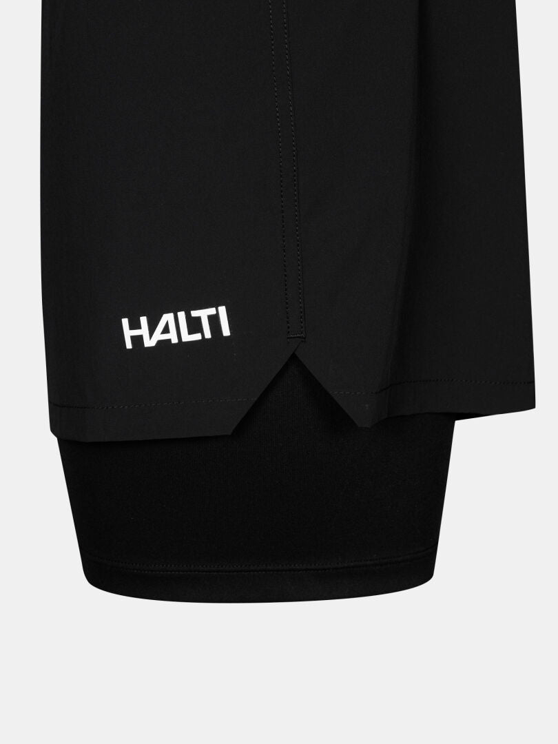 Close-up of Halti Uurto Shorts Men's in black, featuring a white HALTI logo on moisture-wicking fabric.