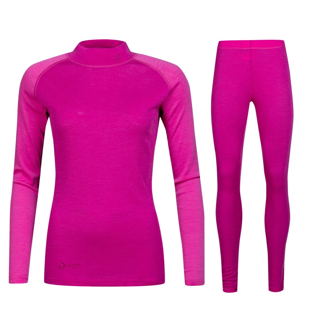 The Halti Neva Merino Base Layer Set Women's in magenta is shown on white, ideal as breathable outdoor clothing.
