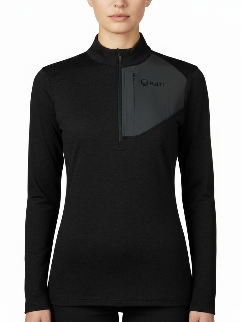 A woman in a Halti Woolforce Women's Merino Wool Shirt with zip collar and chest logo stands against a white background.