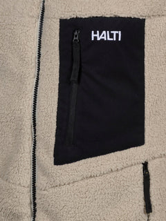Close-up of Halti Lumista Polar Fleece Jacket Mens with a black zippered chest pocket and white embroidered logo.