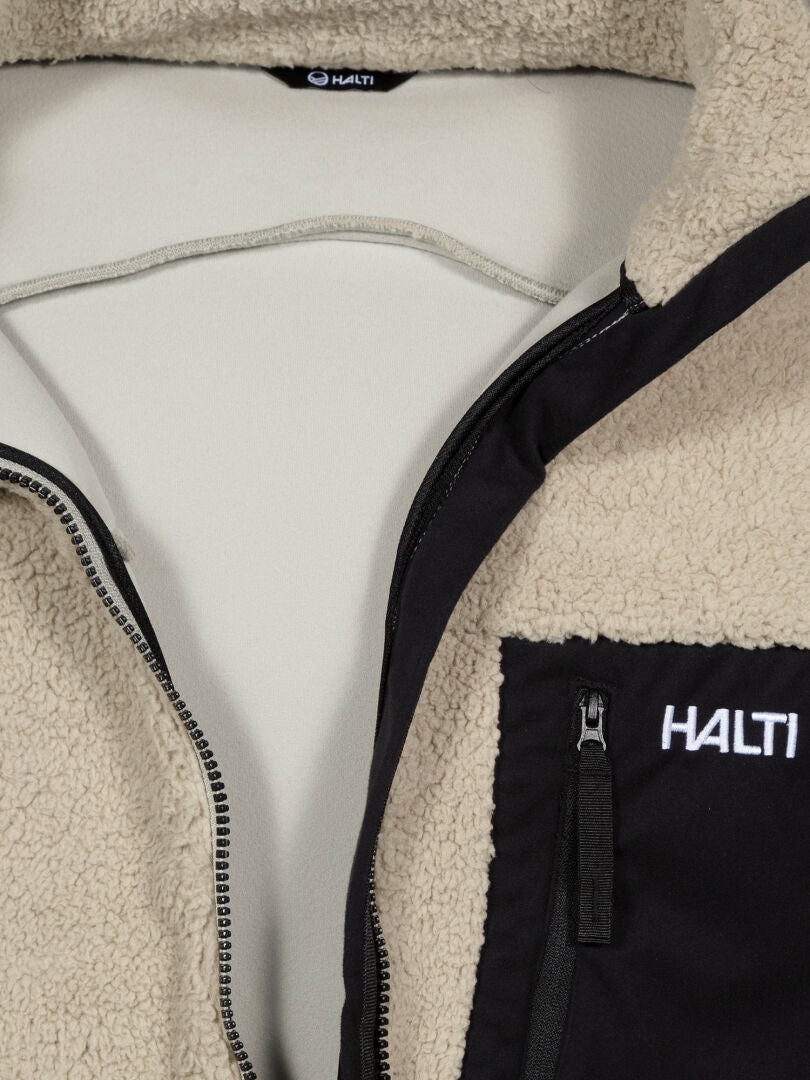 Close-up of the Halti Lumista Polar Fleece Jacket Mens, featuring a black zippered chest pocket and logo.