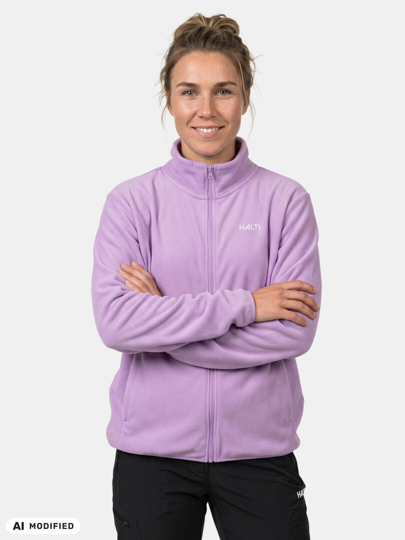 Model wearing Halti Rockmoon Fleece Jacket Women’s, arms crossed, against a plain white background.