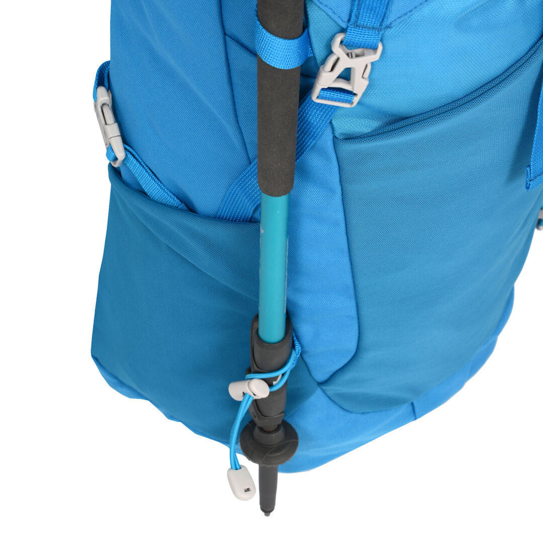 The Halti Pursuit 35 Lite Pack is a blue hiking backpack with a black and blue pole in the side pocket.